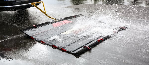 FODBOSS runway sweeper splashing in water