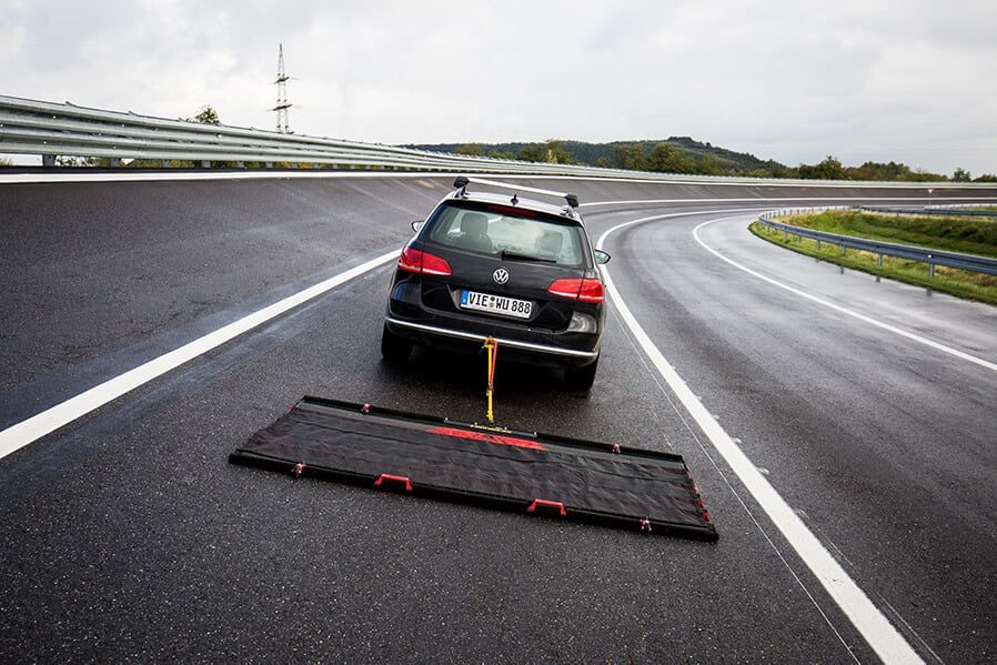 FOD BOSS racetrack sweeper being towed on racetrack