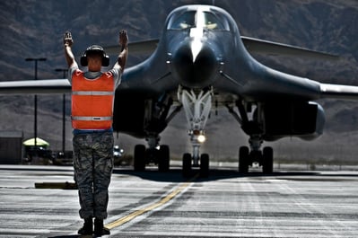 aviation marshaller directing aircraft landing