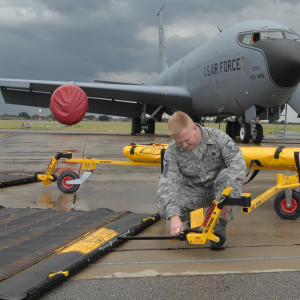 United States Air Force using the FOD* BOSS ultimate Triplex Airport Sweeper