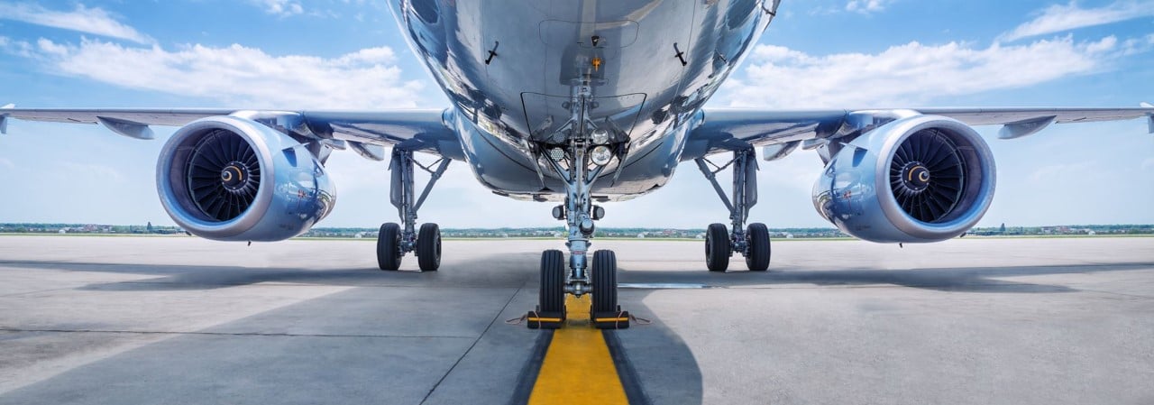 underneath an airplane speeding down runway