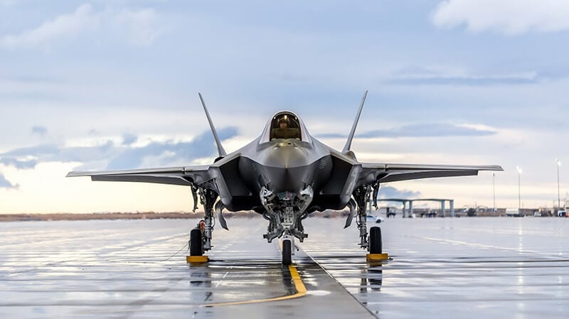 military aircraft on runway